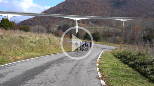 Twenty24 cycling team in front of the Smart Roads bridge