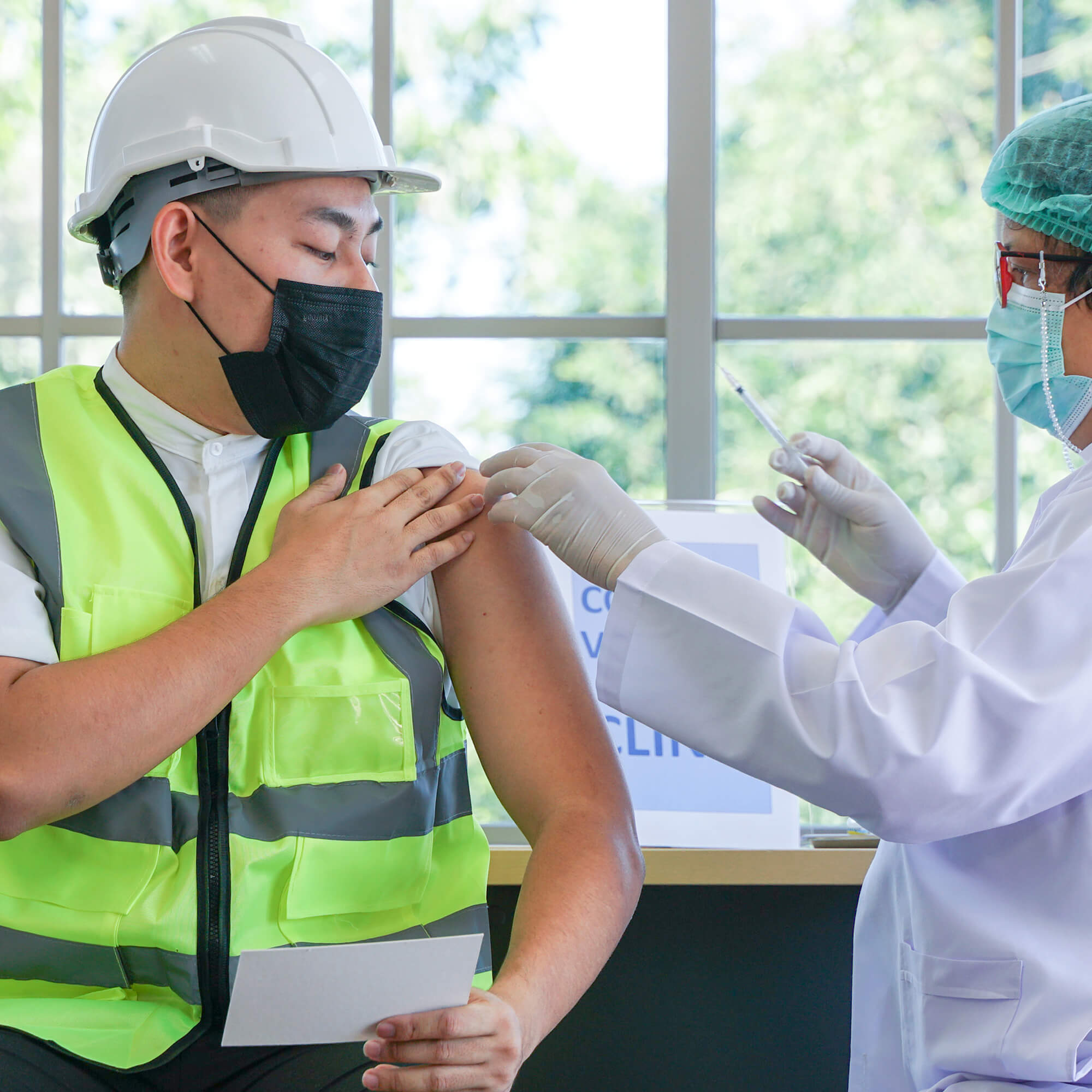 Worker getting vaccinated
