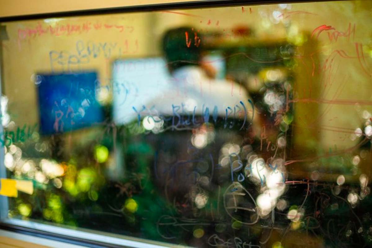 Calculations cover the glass in Feng Guo's office